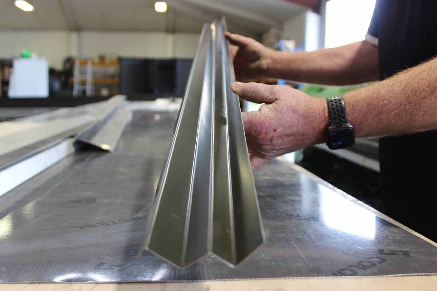 Pre-run spouting profile being checked in Clearwater Spouting’s Christchurch workshop