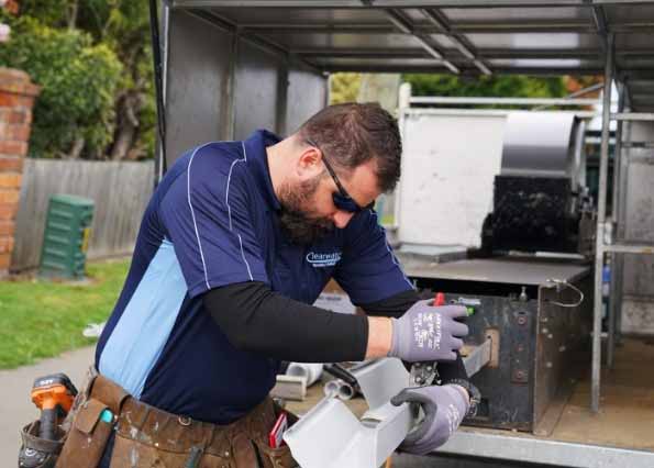 Clearwater Spouting installer preparing metal continuous spouting for a Christchurch install
